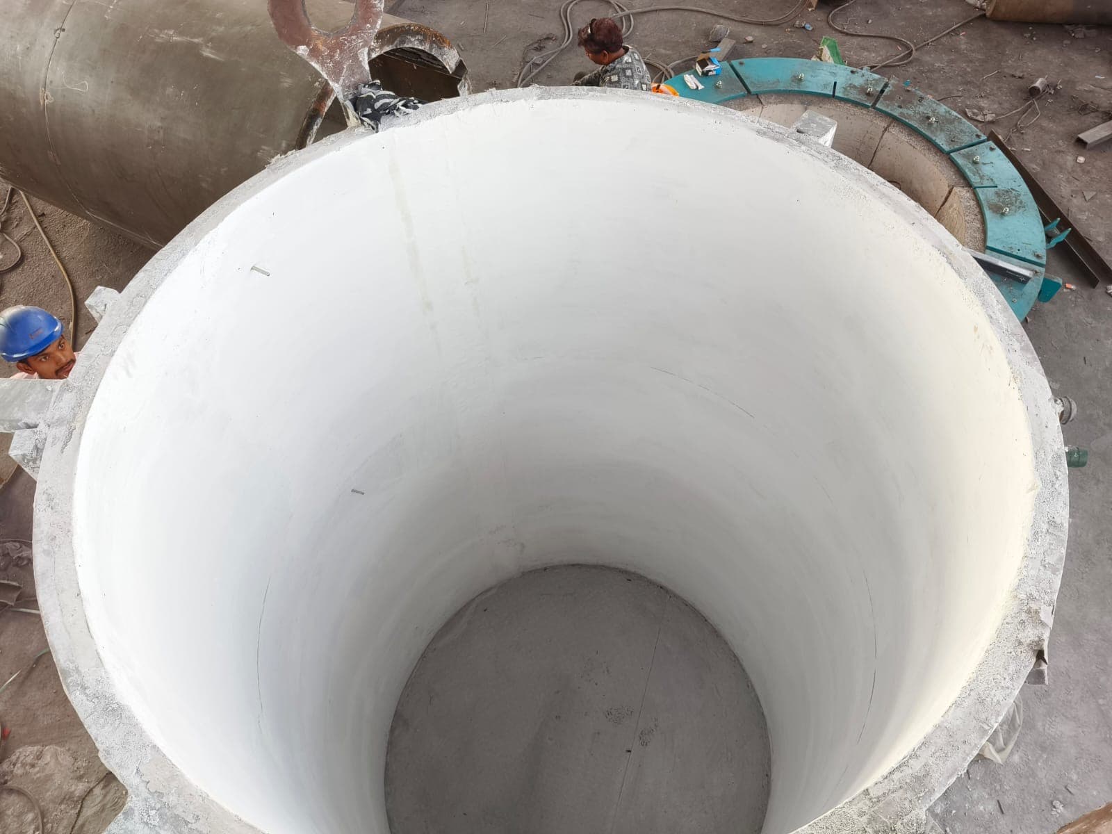 Freshly finished white coil grout inside an induction furnace crucible