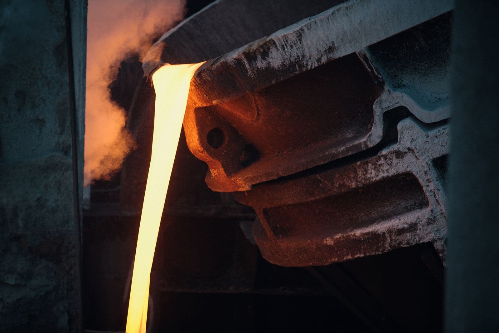 Molten steel poured inside an induction furnace at a foundry